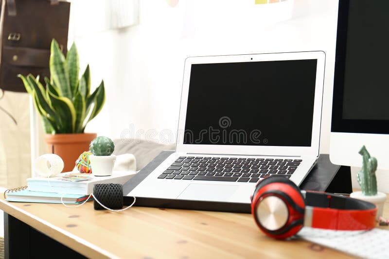 Modern Laptop, Computer and Office Supplies on Wooden Table, Space for