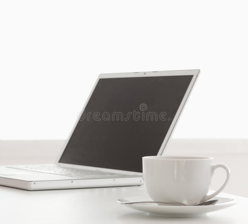 Modern Laptop and Cup of Tea on a Table Stock Photo Image of digital
