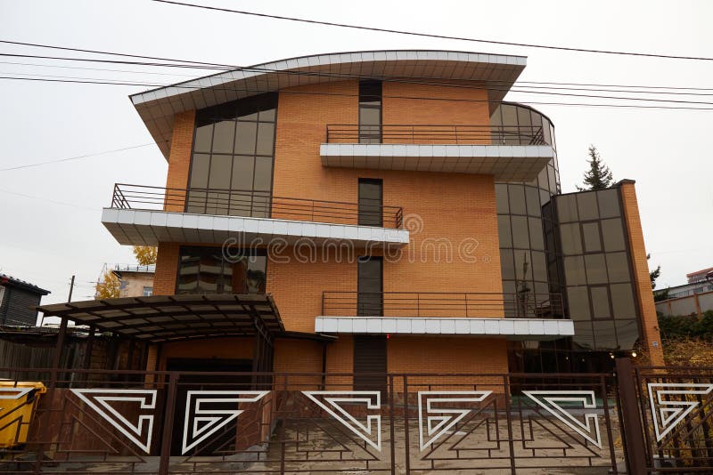 Modern large brick house with balconies royalty free stock images