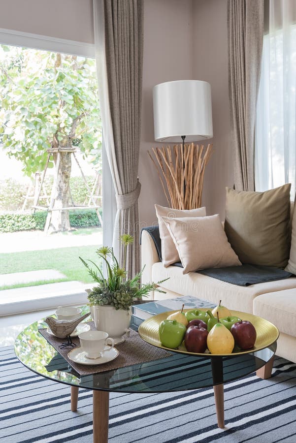 Modern Living Room Design with Round Glass Table on Carpet Stock Photo