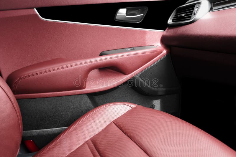back seats of modern luxury car, red leather interior