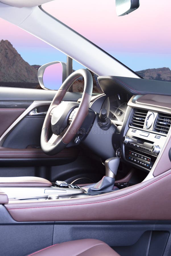 Modern Luxury Car Interior Steering Wheel and Blurred Dashboard. Car