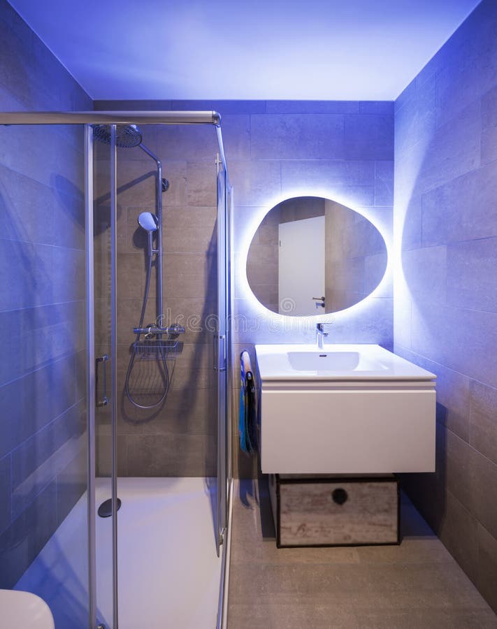 Modern Marble Bathroom with Backlit Mirror Stock Image - Image of ...
