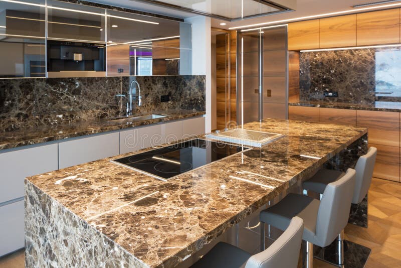 Modern marble kitchen with island royalty free stock photography