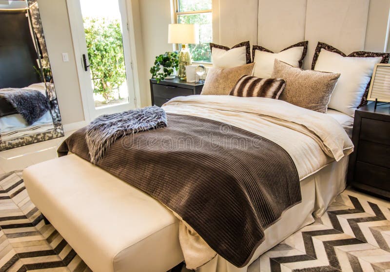 Modern Master Bedroom Bed With Mirror & Nightstands royalty free stock photos
