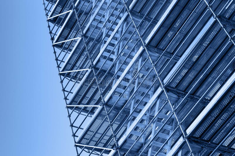 Modern metal scaffolding, blue toned photo. Scaffolding frame stock images, royalty-free photos and pictures
