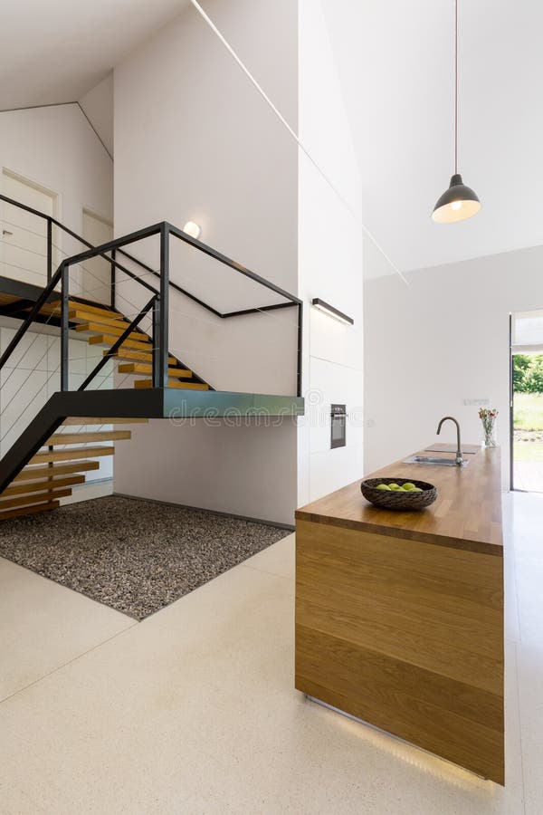 Modern minimalist kitchen and staircase royalty free stock image