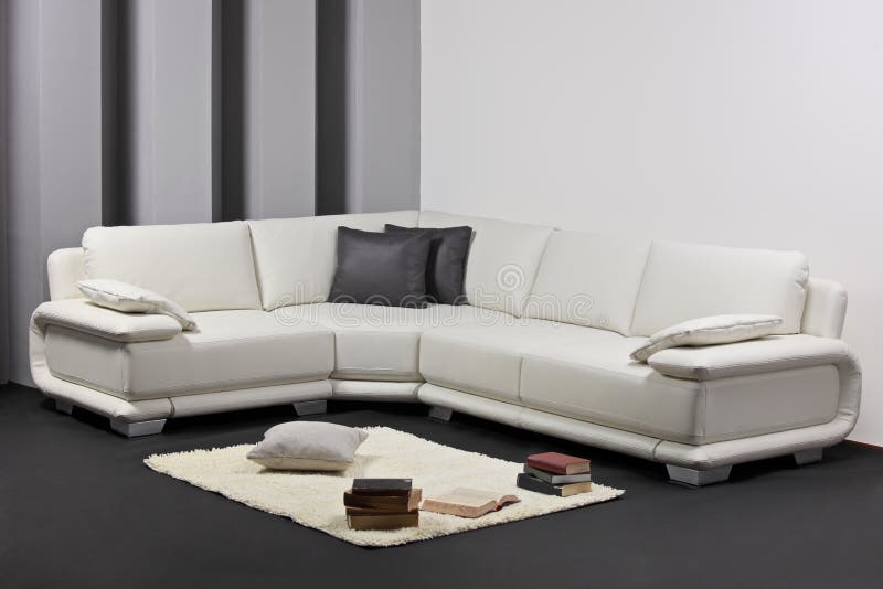 A modern minimalist living-room with furniture stock photo