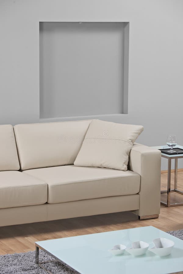 A modern minimalist living-room with leather sofa stock photo