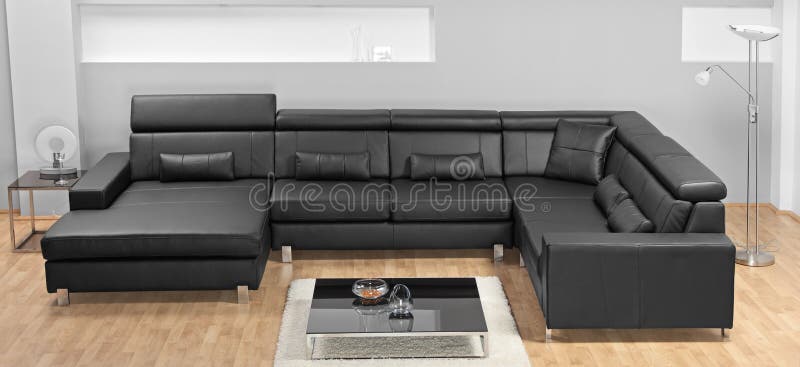 A modern minimalist living-room with leather sofa stock photography