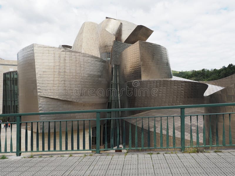 Modern museum building in European BILBAO city at Biscay province in SPAIN, cloudy sky in 2019 warm sunny summer day on September. Modern museum building in European BILBAO city at Biscay province in SPAIN, cloudy sky in 2019 warm sunny summer day on September.