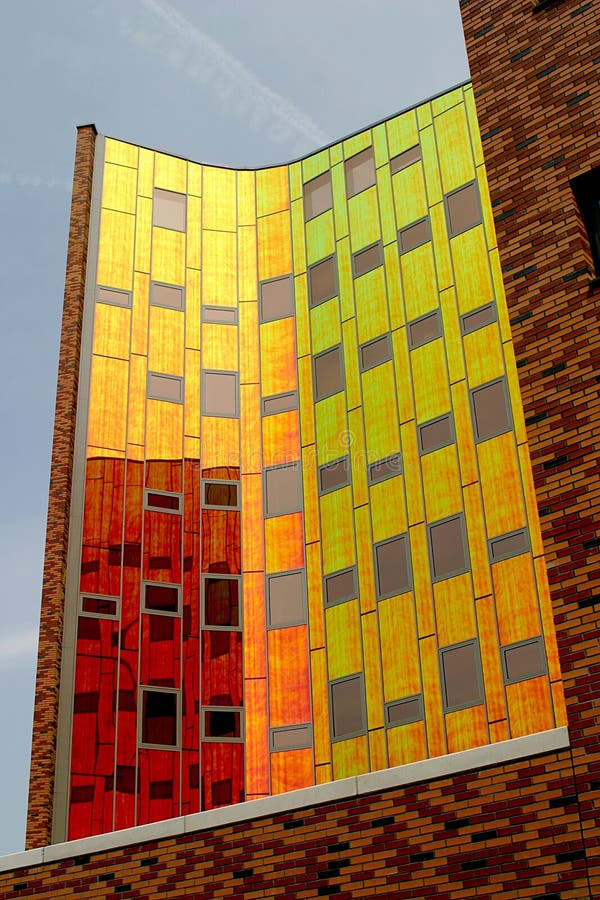 A modern office-building, equipped with coloured reflecting wall