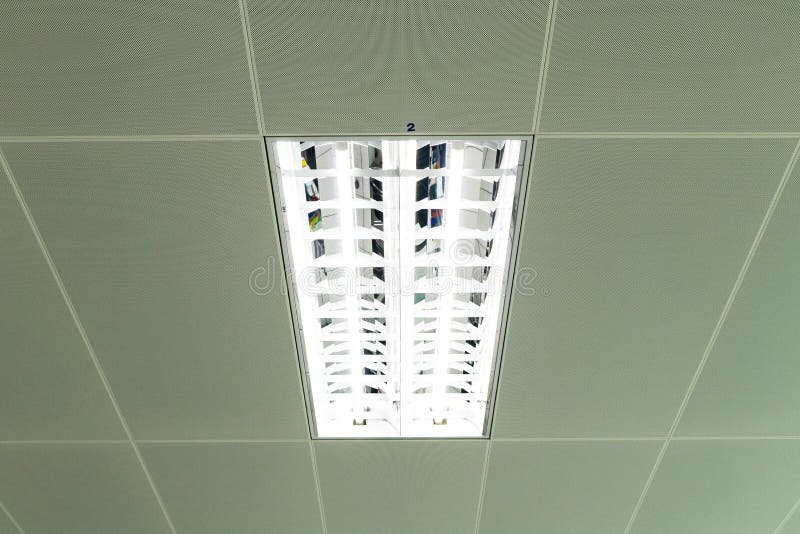 Modern Office Neon Light or Fluorescent Light with White Ceiling Bulbs in Uprisen View. Stock
