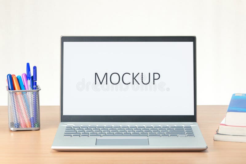Modern personal computer with blank white screen, keyboard on desk. stock photo