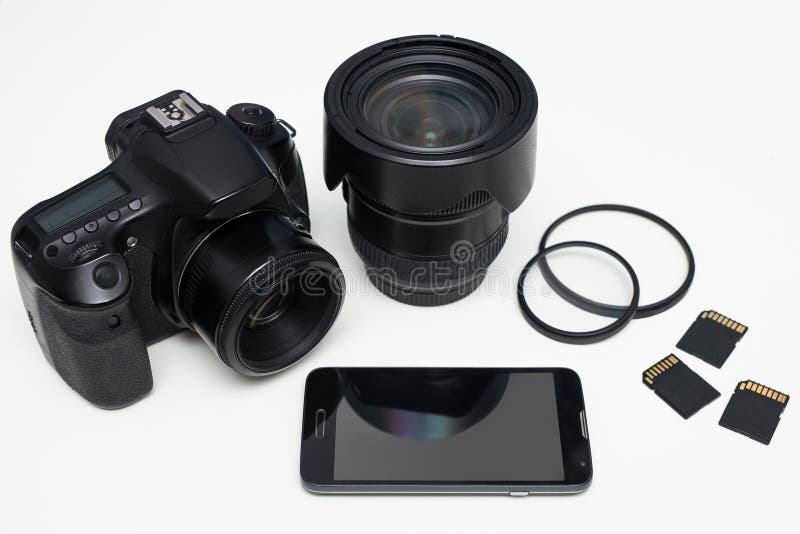 Modern Photography Equipment and Smart Phone Over White Table Stock