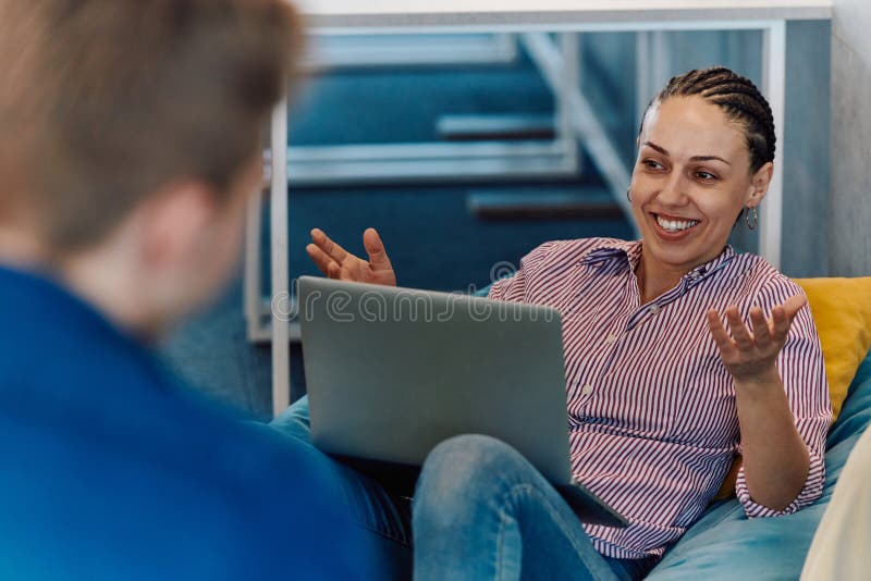 A modern programmer discussing future business projects with colleagues in a modern startup office royalty free stock photography