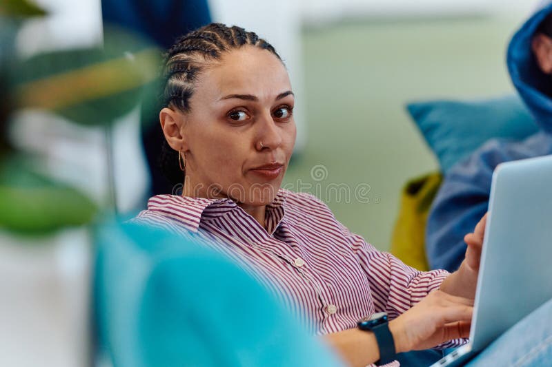 A modern programmer discussing future business projects with colleagues in a modern startup office royalty free stock photo