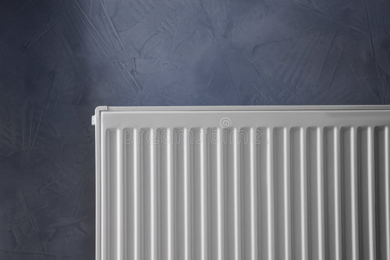 Modern Radiator on Grey Wall. Central Heating System Stock Image