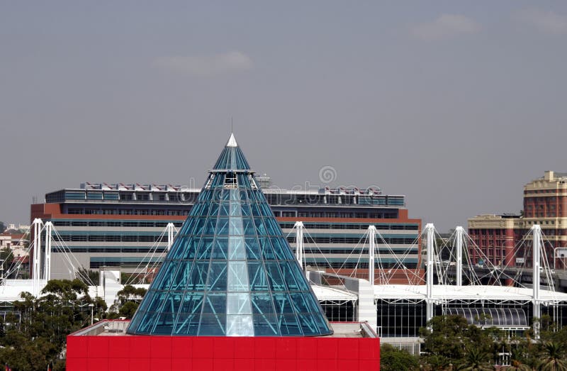 Modern Red Building With Class Cone Roof