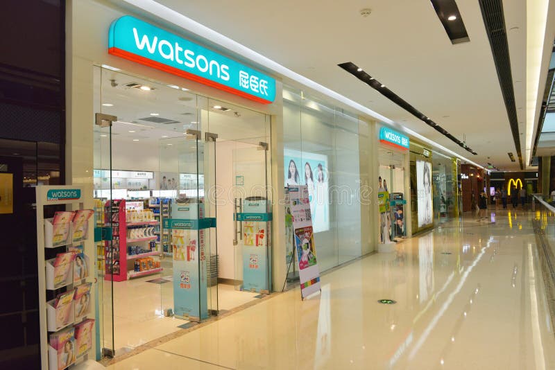 Modern retail shopping mall / centre with many busy shoppers shopping stock image Modern retail shopping mall / centre with many busy shoppers shopping stock image