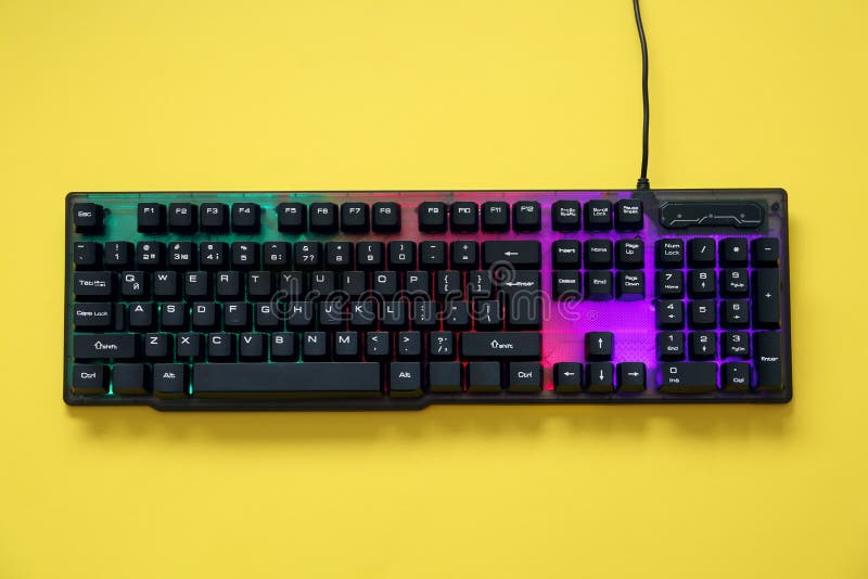 Modern RGB Keyboard on Yellow Background, Top View Stock Image - Image