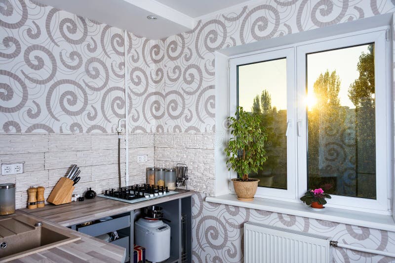 Modern simple kitchen interior design in light apartments.
