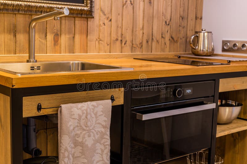 Modern Sink in a Wooden Kitchen in the Interior. Stock Photo Image of