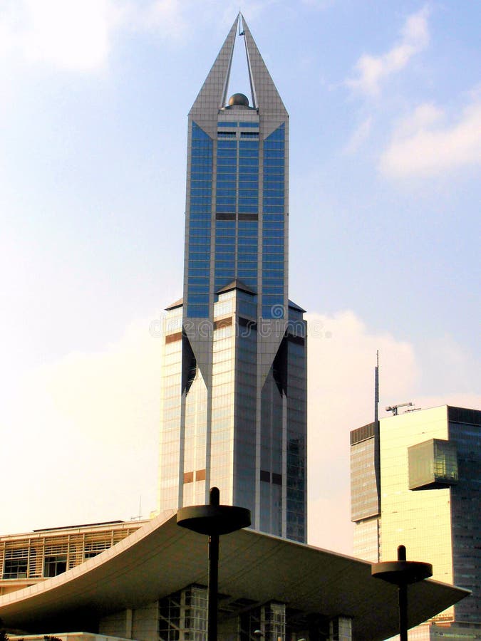 Modern Skyscraper with Blue Sky in the Background Stock Photo - Image : A astonishing photo depicting an beautiful scenery. The colors are just striking and blend ideally. Its layout is fantastic, and its features are extremely clear.