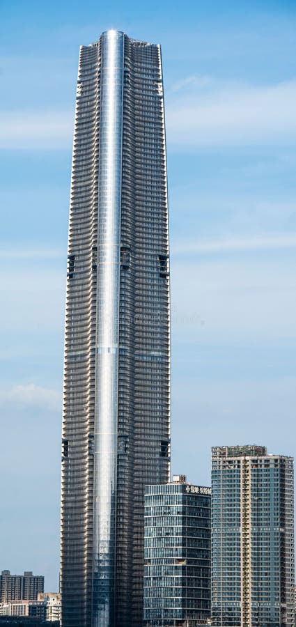 Modern skyscraper with glass facade in cityscape royalty free stock images