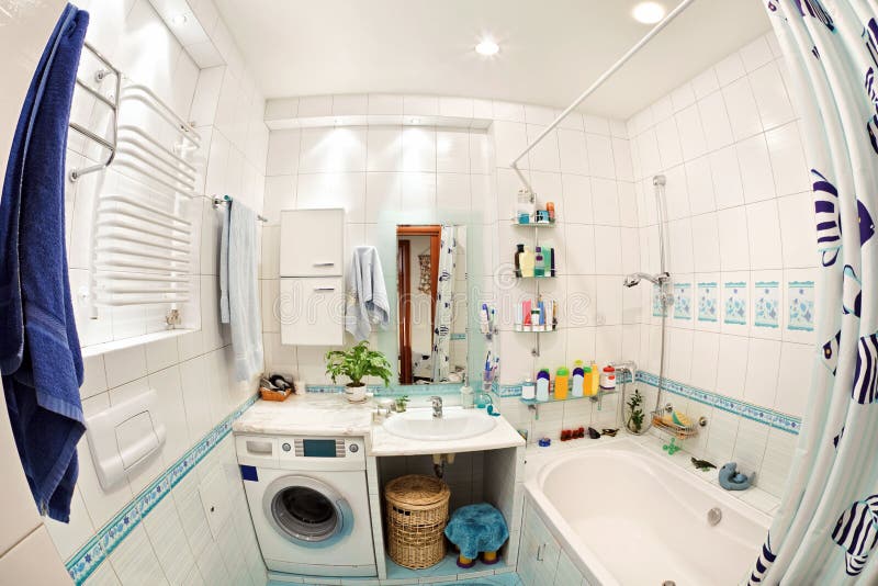 Modern small bathroom in blue colors wide angle fisheye view. Bathtub stand stock images, royalty-free photos and pictures