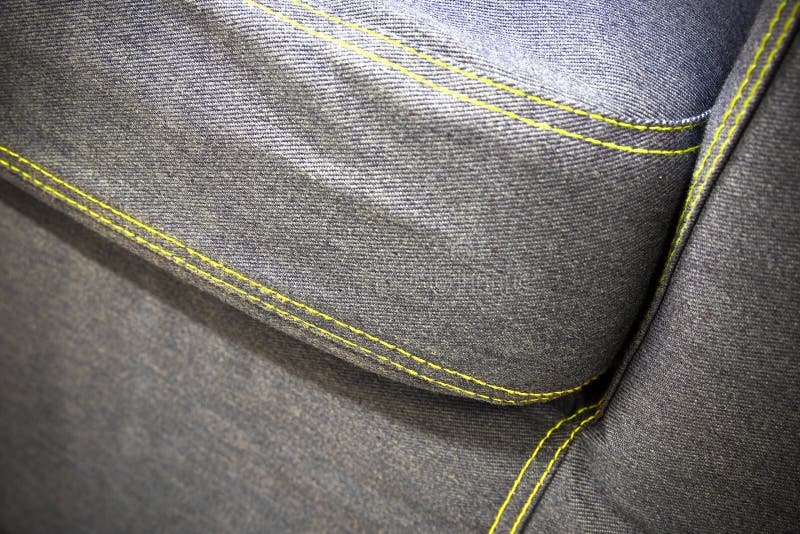 Modern sofa made ​​of denim, close detail royalty free stock photography