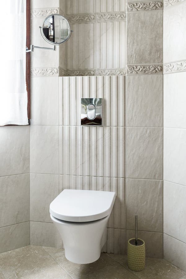 The Tiles in the Toilet are Made of Brown Mosaic .Background or Texture