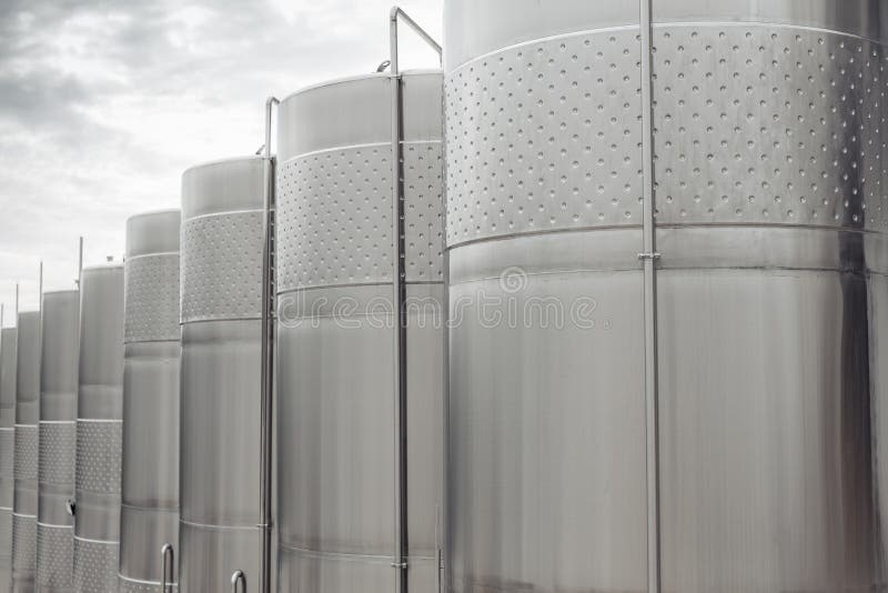 Modern Stainless Steel Barrels for Wine Fermentation at a Winery. Wine Industry. Stock Photo