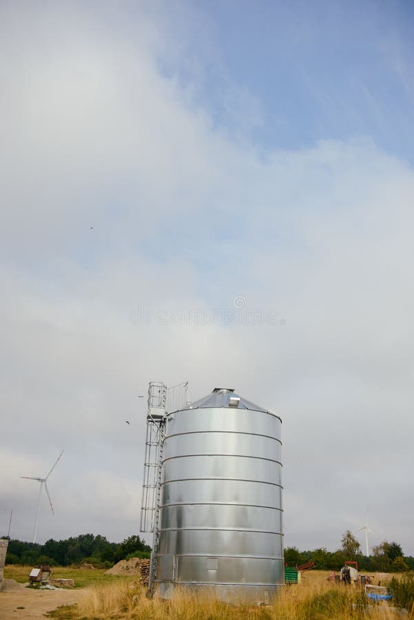 Grain silo located at the farm. Harvest time in summer