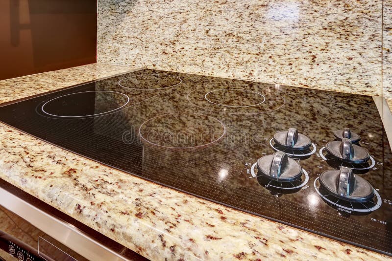 Modern Stove with Flat Shiny Surface. Close Up View. Kitchen App Stock