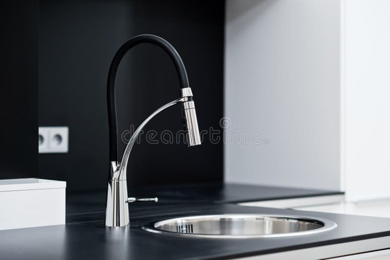 Modern stylish faucet in the design kitchen royalty free stock photo