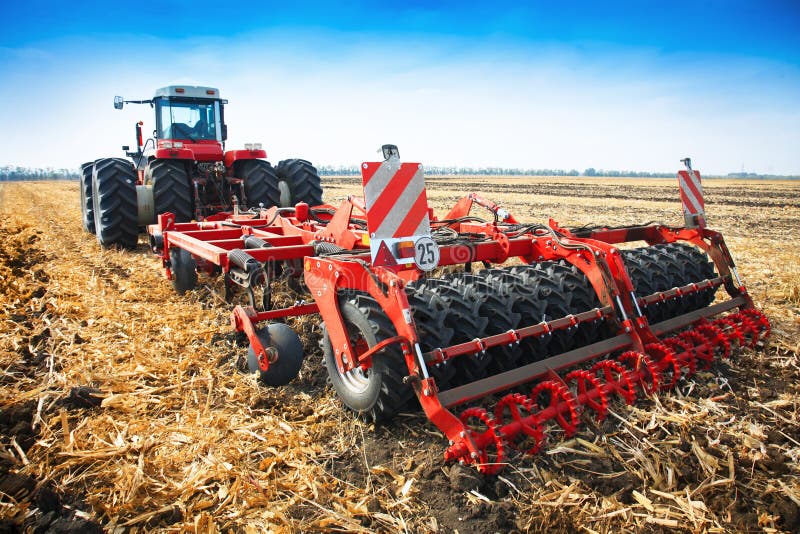 Modern Tractor in the Field with Complex for the Plowing of Soil. Stock Image Image of farming