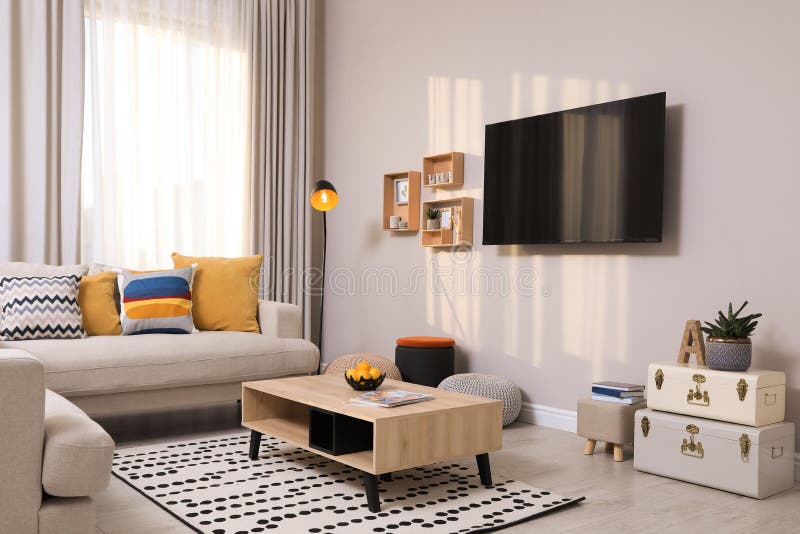 Modern TV, Comfortable Sofa and Decor Elements in Room Stock Photo