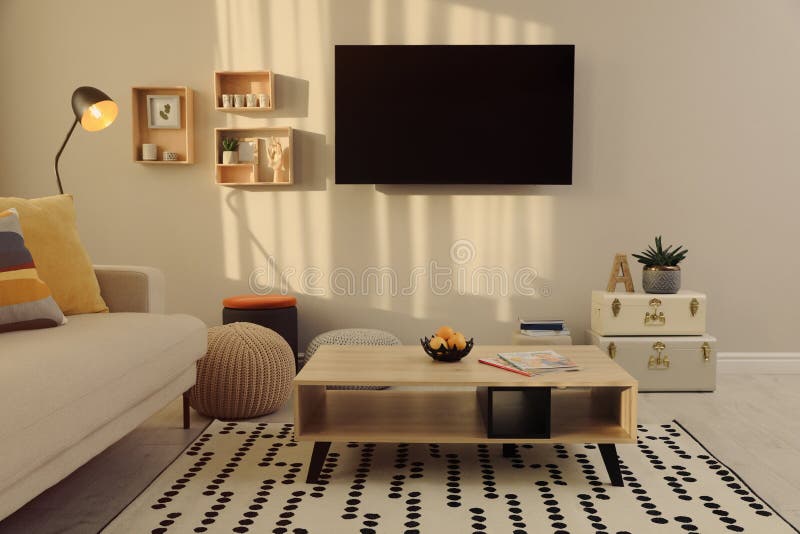 Modern TV, Comfortable Sofa and Decor Elements in Living Room Stock