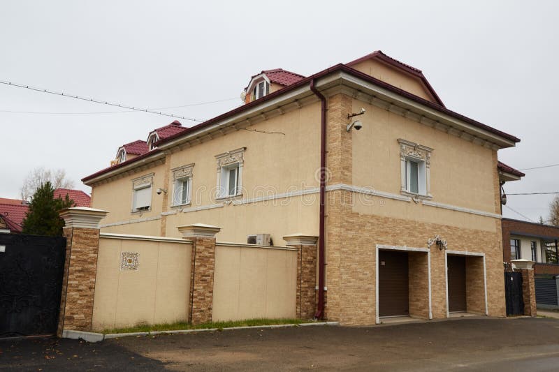 Modern two-storey house made of brick and other materials royalty free stock images