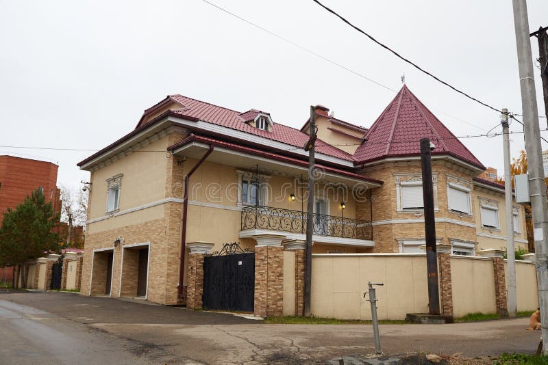 Modern two-storey house made of brick and other materials royalty free stock image