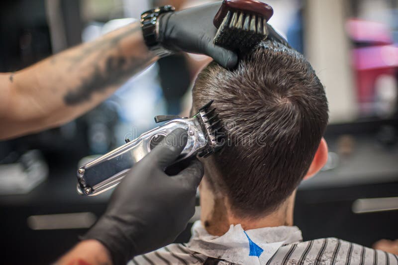 Modern Urban Hairdresser Cut Hair with Hair Trimmer in Professional