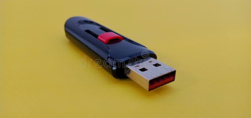 Modern USB Flash drive on yellow background stock images