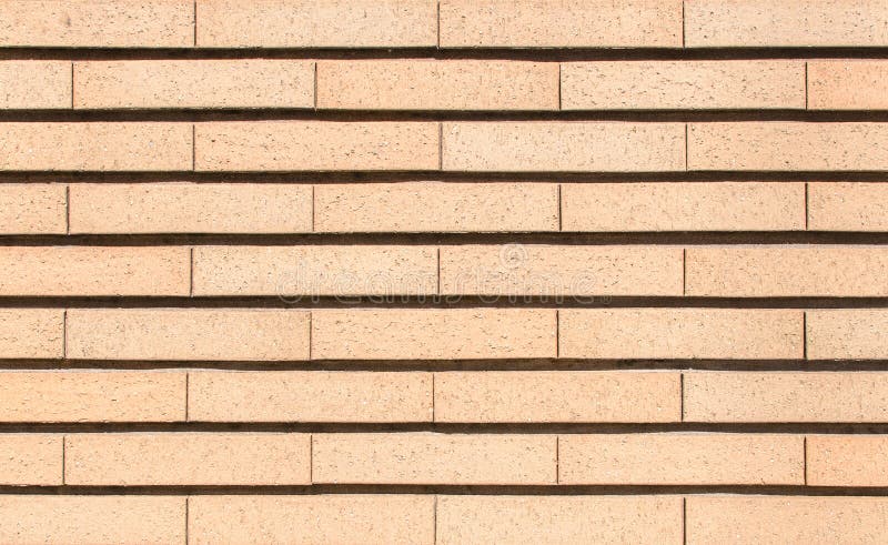 Modern vibrant yellow brick wall as a background image royalty free stock photography
