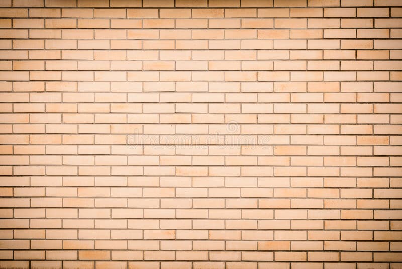 Modern vibrant yellow brick wall as a background image stock image