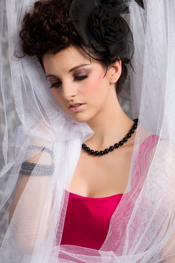 Modern victorian brunette model in red dress