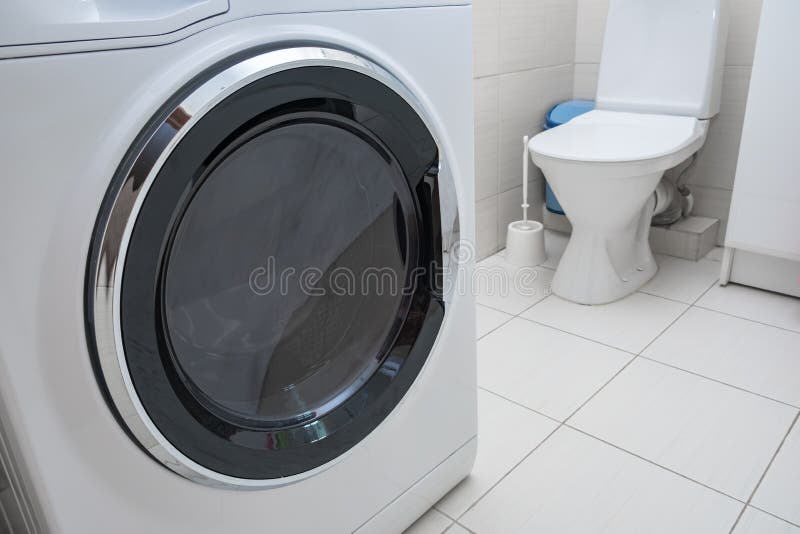 Modern Washing Machine in a Bathroom, Laundry Concept Stock Image