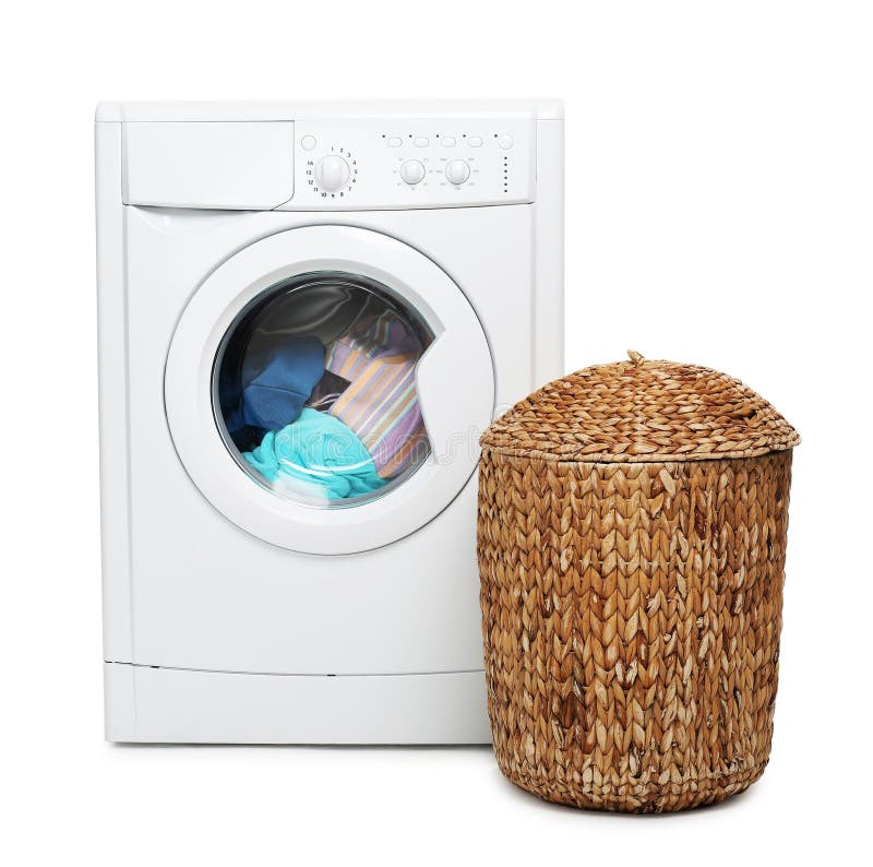 Modern washing machine and laundry basket isolated on white stock photos