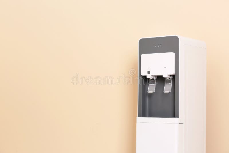 Modern water cooler against color background royalty free stock photo
