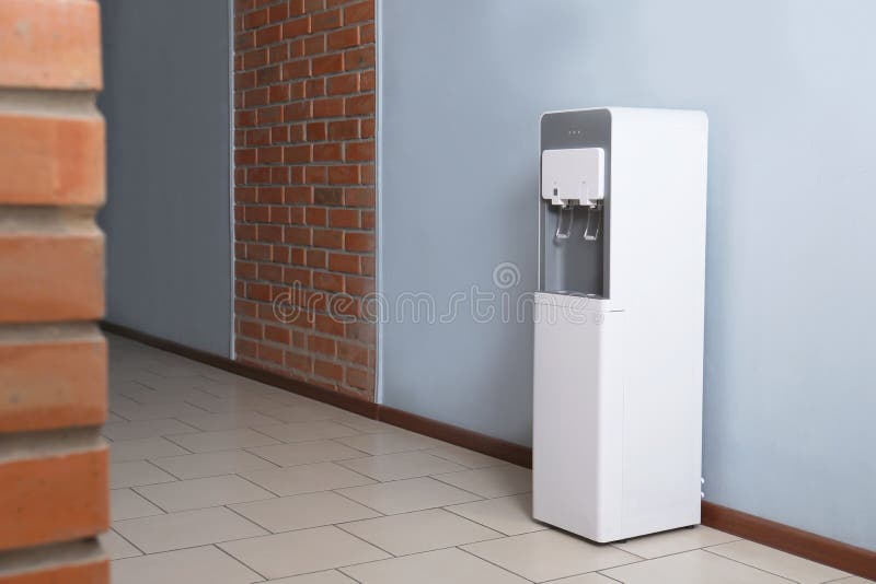 Modern water cooler in office royalty free stock photography